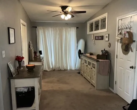 a bedroom with furniture and a fireplace