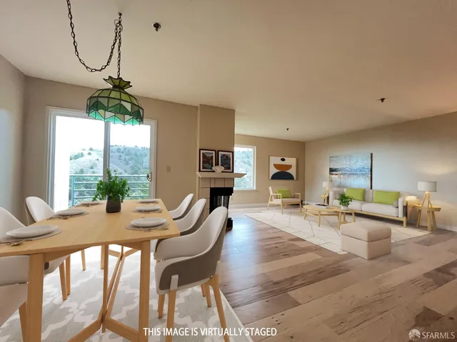 a view of a dining room with furniture window and outside view