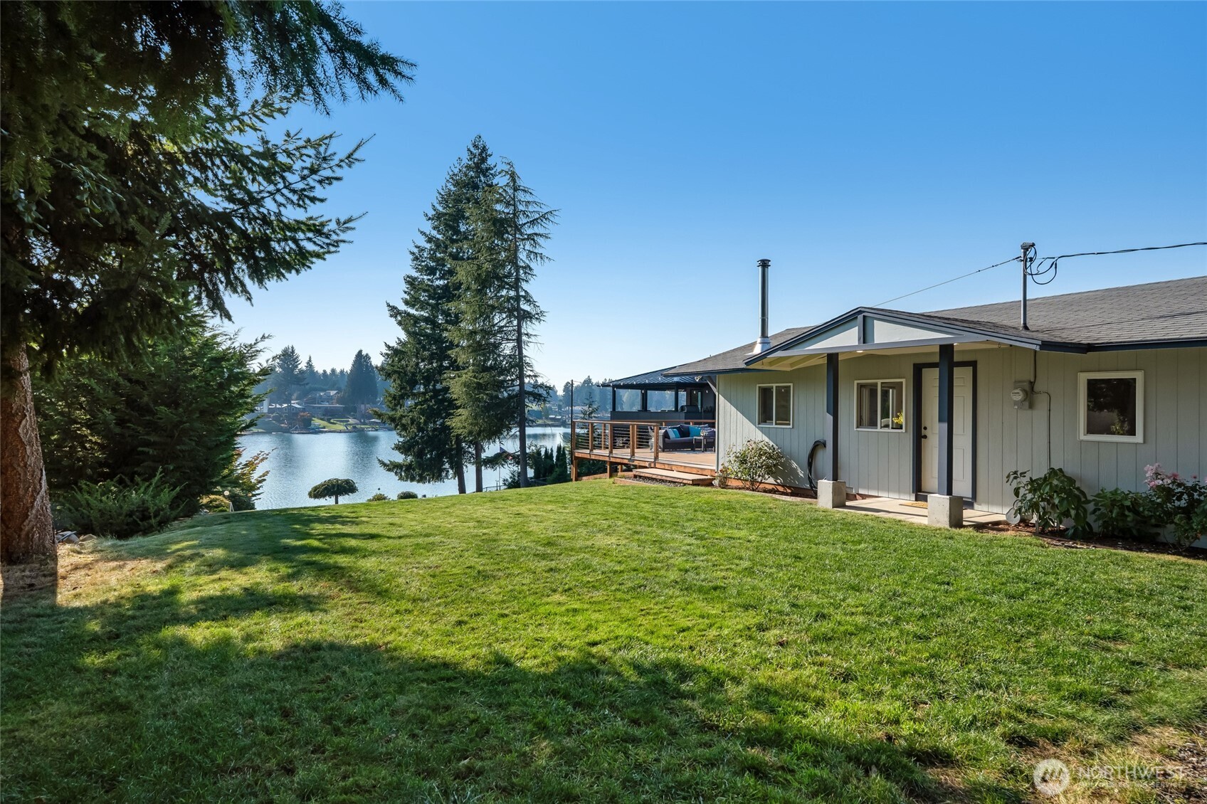 1722 Channel Road East Lake Tapps, WA 98391 - Photo 23 of 35 a view of a house with a yard