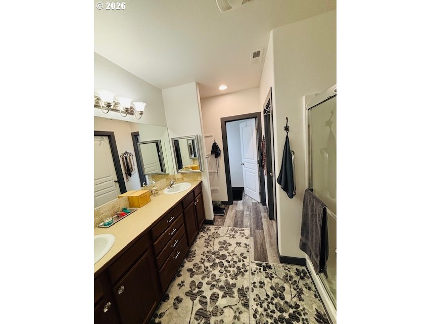 5367 Elk Ridge Drive Eugene, OR 97402 - Photo 17 of 31 a bathroom with sink a mirror and a shower