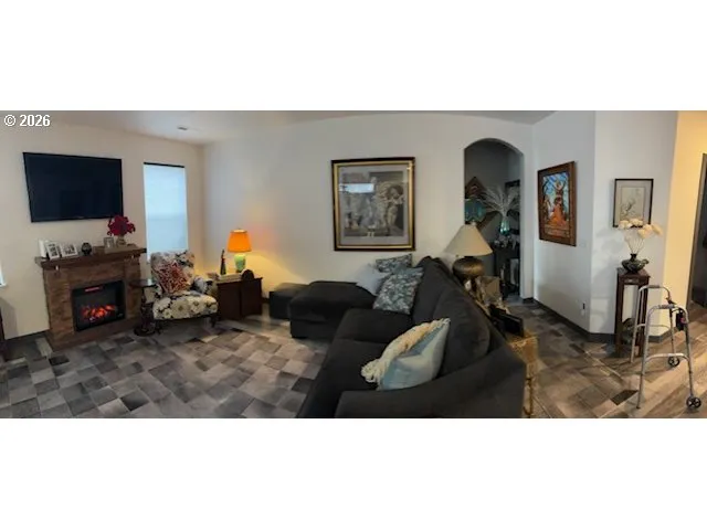 a view of a dining room with furniture and chandelier