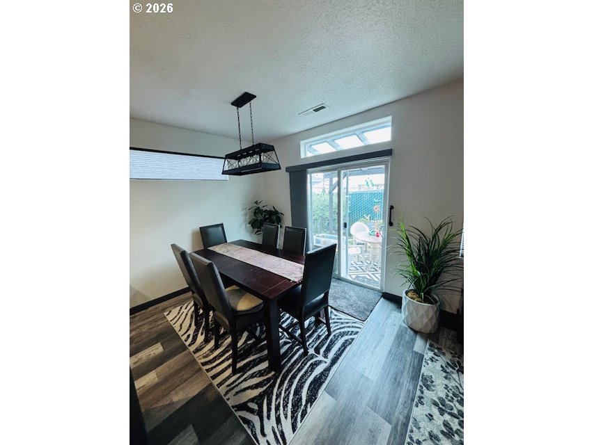 5367 Elk Ridge Drive Eugene, OR 97402 - Photo 20 of 31 a view of a dining room with furniture and wooden floor