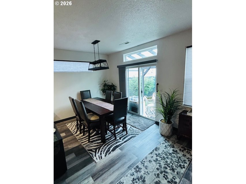 5367 Elk Ridge Drive Eugene, OR 97402 - Photo 21 of 31 a view of a dining room with furniture and chandelier