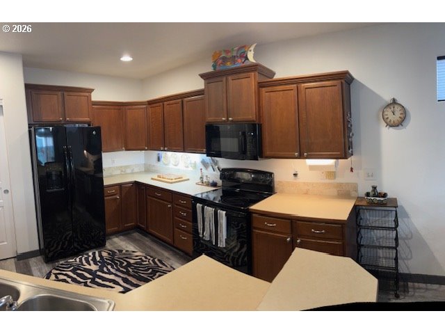 5367 Elk Ridge Drive Eugene, OR 97402 - Photo 22 of 31 a kitchen with a refrigerator and a stove top oven