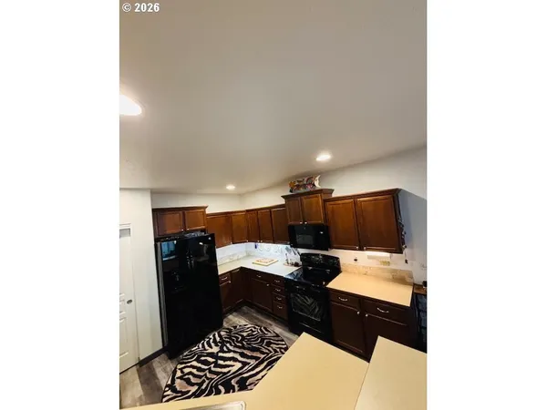 a kitchen with a sink and a refrigerator