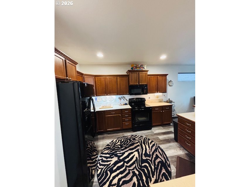 5367 Elk Ridge Drive Eugene, OR 97402 - Photo 26 of 31 a kitchen with a sink and a refrigerator