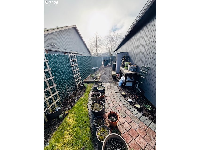5367 Elk Ridge Drive Eugene, OR 97402 - Photo 29 of 31 a view of a balcony with chairs and potted plants