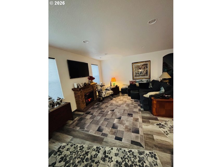 5367 Elk Ridge Drive Eugene, OR 97402 - Photo 9 of 31 a living room with furniture and a flat screen tv