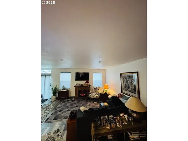 a bedroom with a bed and a night stand