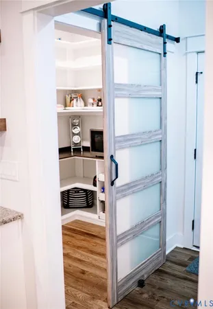 a kitchen with a refrigerator and a window
