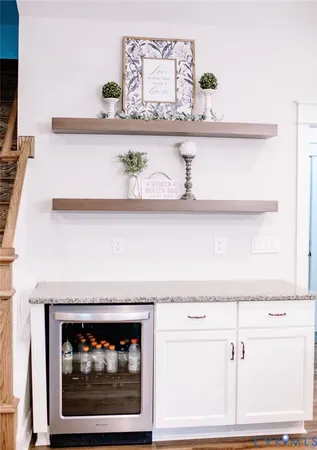 a close view of a fireplace with a vase of flowers on it