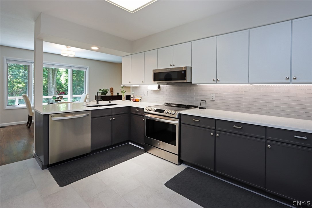 8646 Salt Springs Road Manlius, NY 13104 - Photo 8 of 48 Fully applianced kitchen with electric stove, dish
