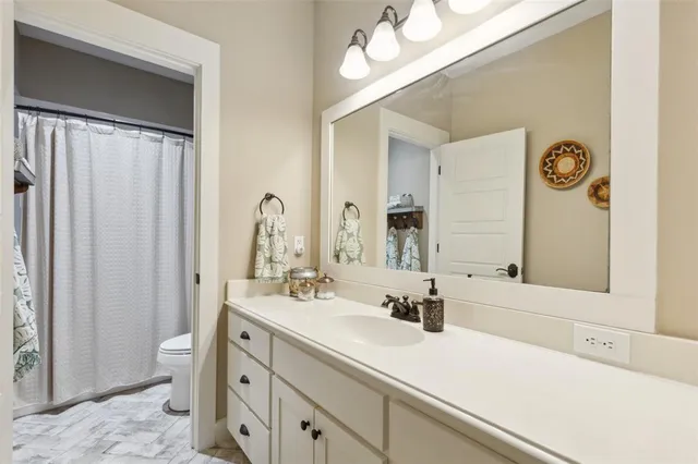 a bedroom with a bed and a chair