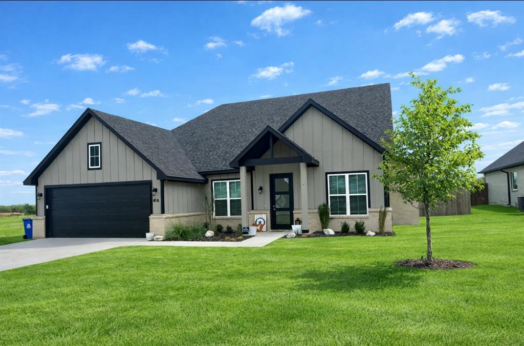 416 Austin Street Gainesville, TX 76240 - Photo 1 of 33 a front view of house with a garden and patio