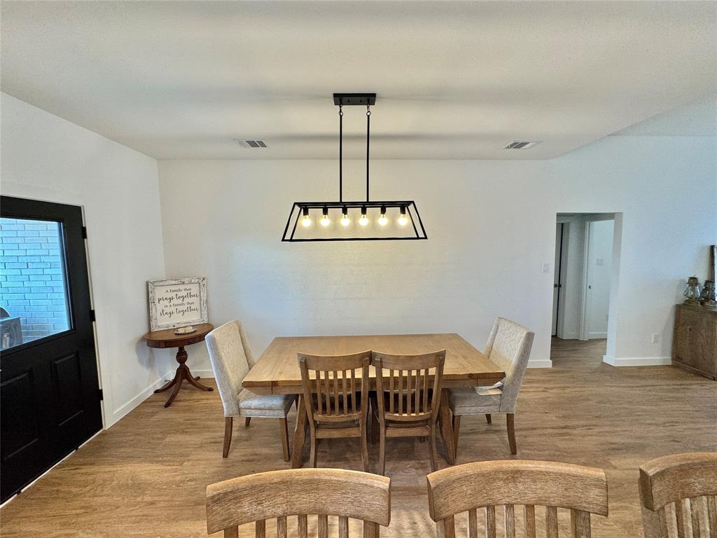 416 Austin Street Gainesville, TX 76240 - Photo 12 of 33 a view of a dining room with furniture