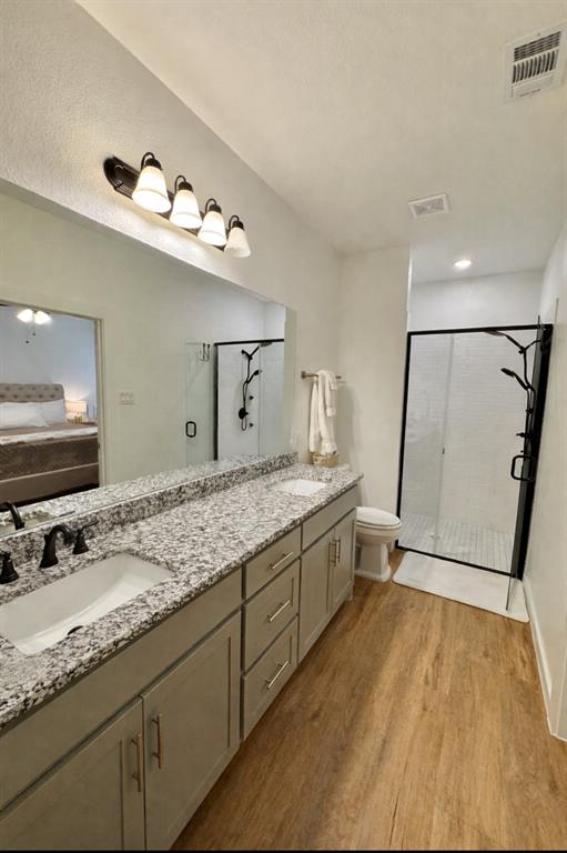 416 Austin Street Gainesville, TX 76240 - Photo 19 of 33 a bathroom with a granite countertop sink mirror and double