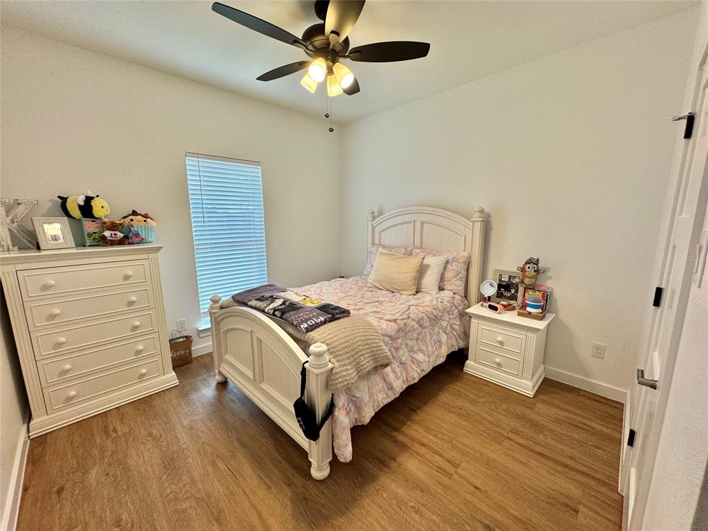 416 Austin Street Gainesville, TX 76240 - Photo 23 of 33 a bedroom with a bed and a dresser