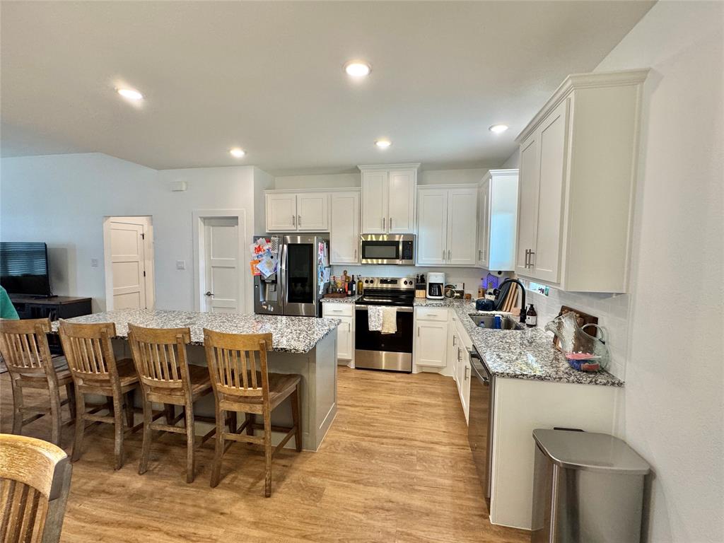 416 Austin Street Gainesville, TX 76240 - Photo 10 of 33 a view of kitchen dining table and chairs