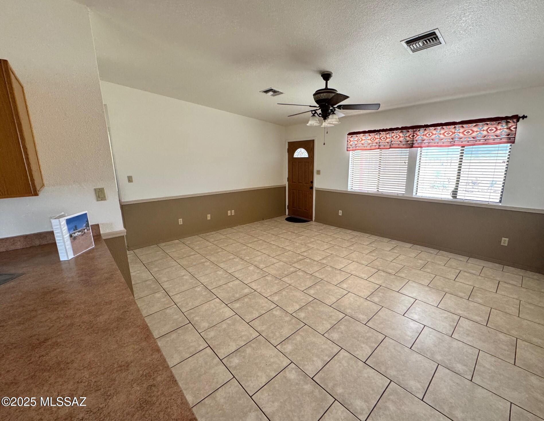 13384 South Cottonwood Road Pearce, AZ 85625 - Photo 9 of 46 a view of an empty room with a window