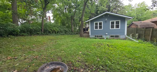 a sign board with a yard