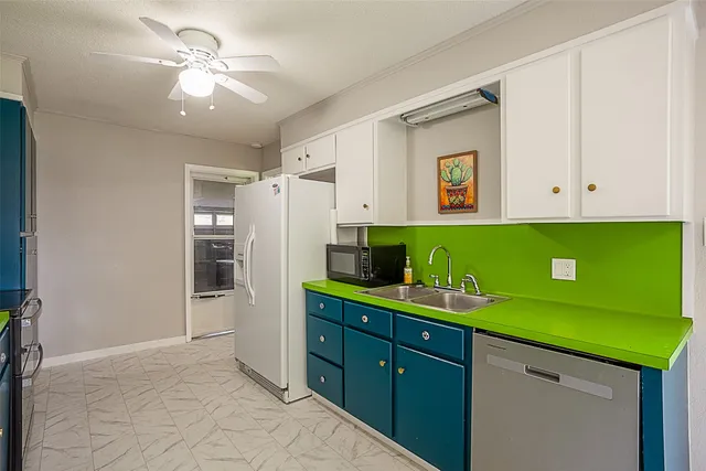 a kitchen with a sink and cabinets