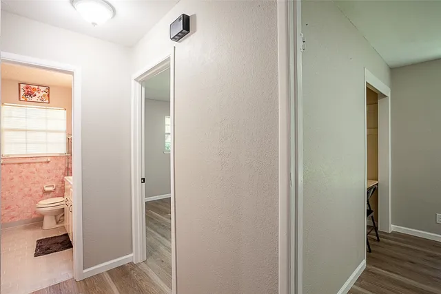 a view of a bathroom from a hallway