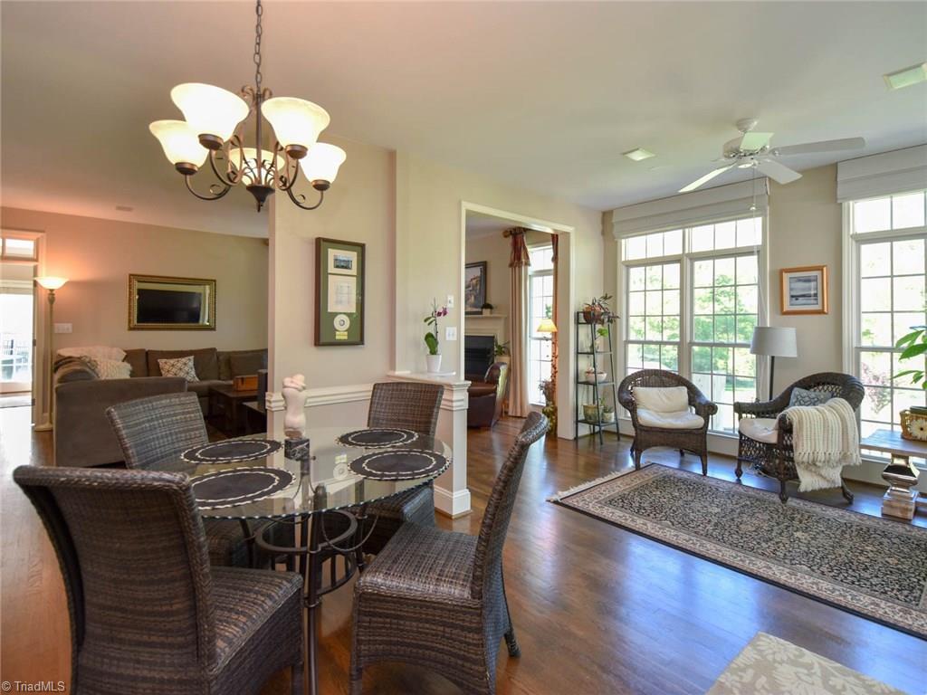 3817 Pinetop Road Greensboro, NC 27410 - Photo 13 of 29 Breakfast area is adjacent to sunroom/sitting room with door to multi-level deck.