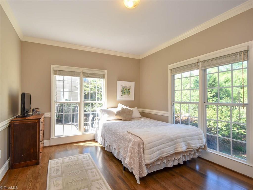 3817 Pinetop Road Greensboro, NC 27410 - Photo 18 of 29 Downstairs bedroom with walk in closet and full en suite bath.