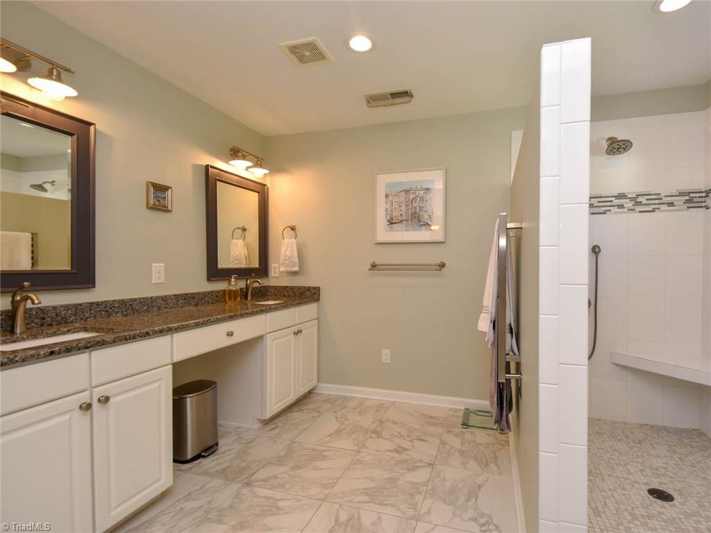 3817 Pinetop Road Greensboro, NC 27410 - Photo 20 of 29 Master bath renovation completed wi last two years. Double vanities, granite tops, tile floor, towel warming rack, and large walk in shower. BEAUTIFUL!