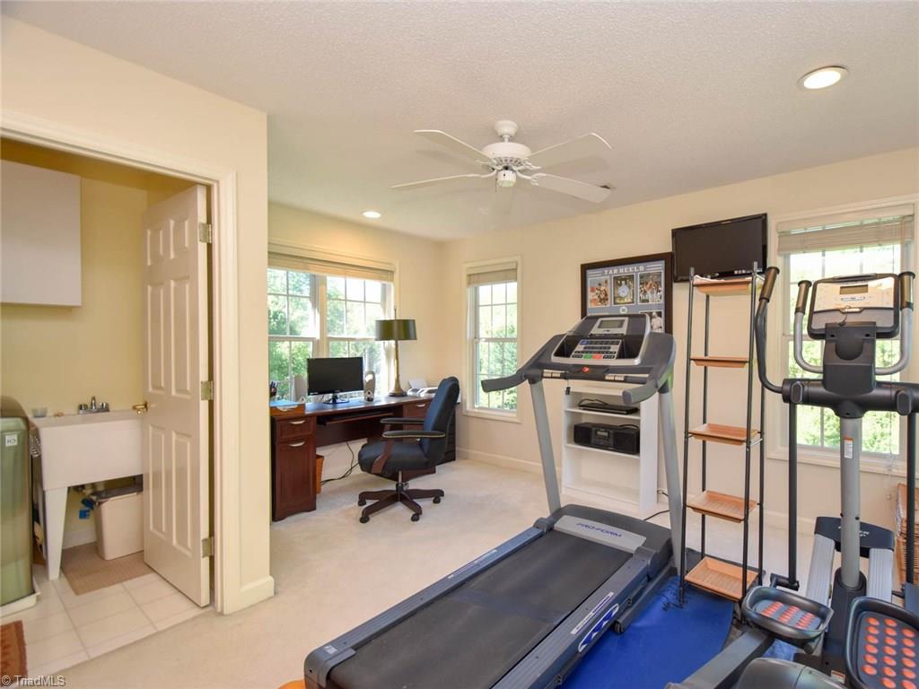 3817 Pinetop Road Greensboro, NC 27410 - Photo 22 of 29 This room is currently being used as exercise room, but could easily be a bonus space, office, or 6th bedroom. Upstairs laundry room accessed through this room.
