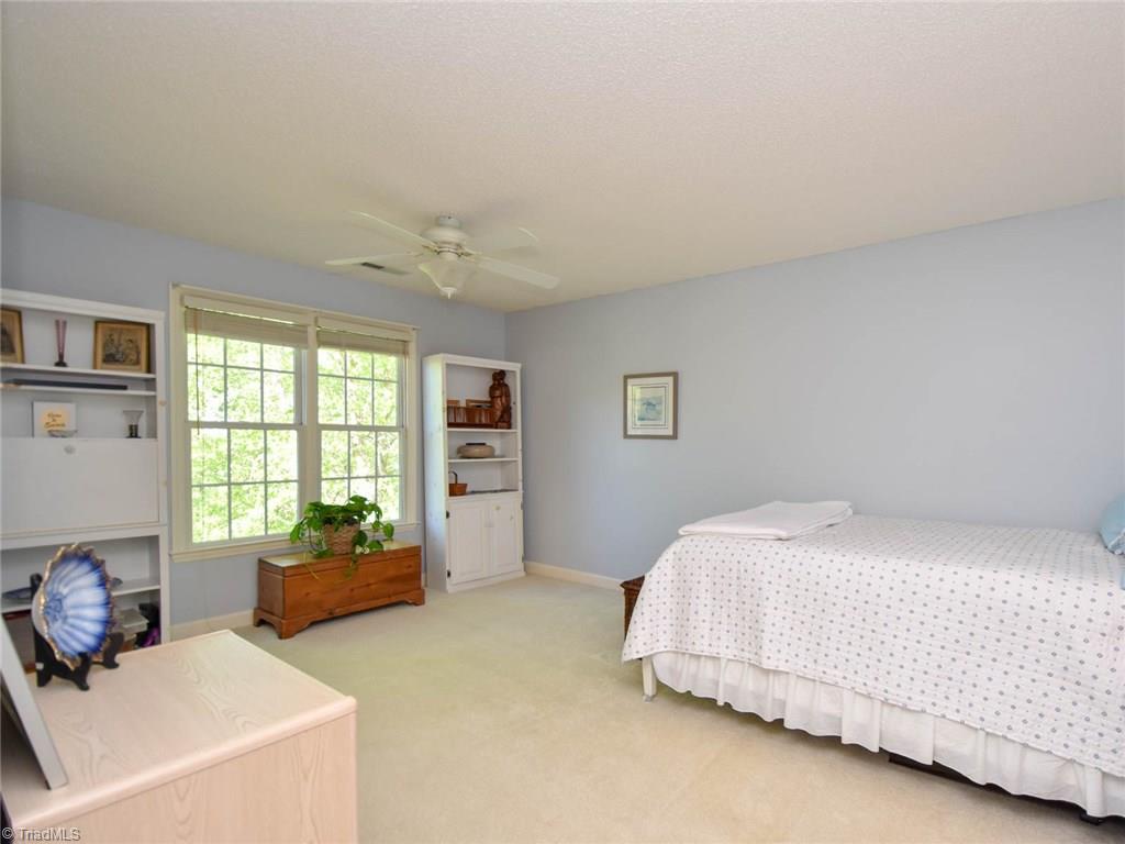 3817 Pinetop Road Greensboro, NC 27410 - Photo 24 of 29 Third bedroom also adjacent to jack n jill bath. Walk in attic with large cedar closet accessed thru this room as well.