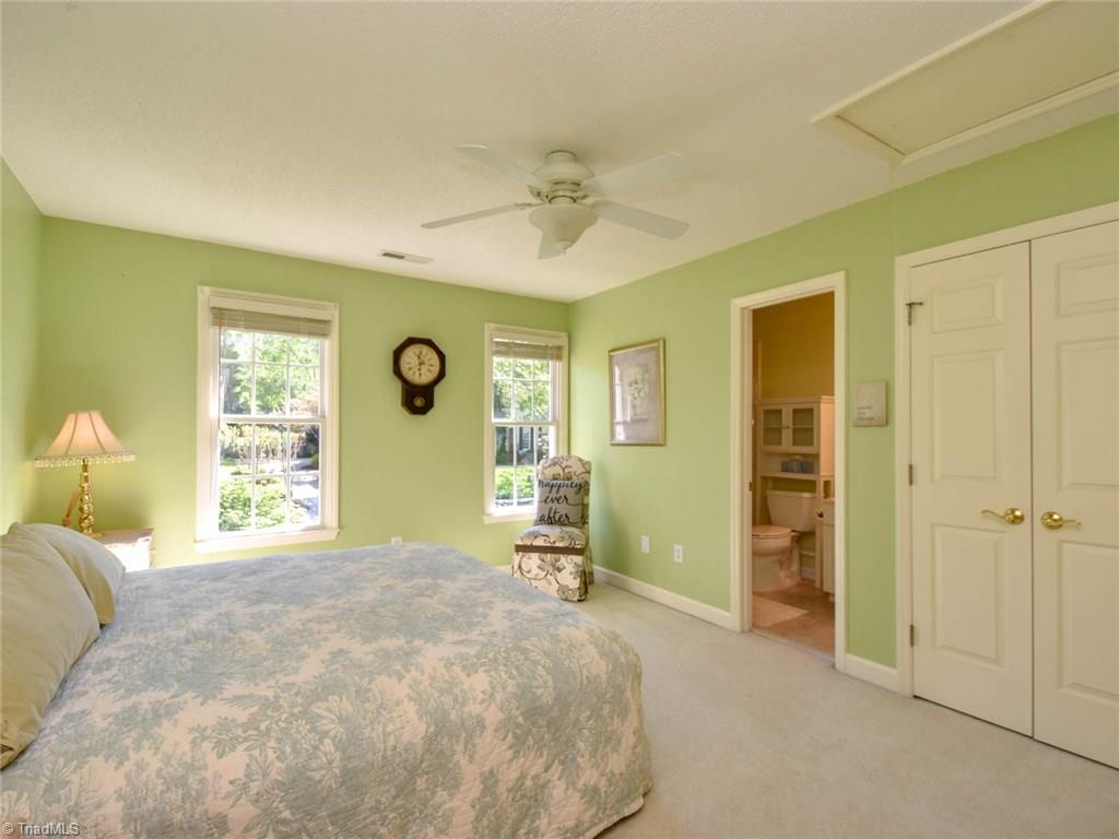 3817 Pinetop Road Greensboro, NC 27410 - Photo 25 of 29 Fourth BR upstairs looks out towards front yard and has its own en suite full bath.