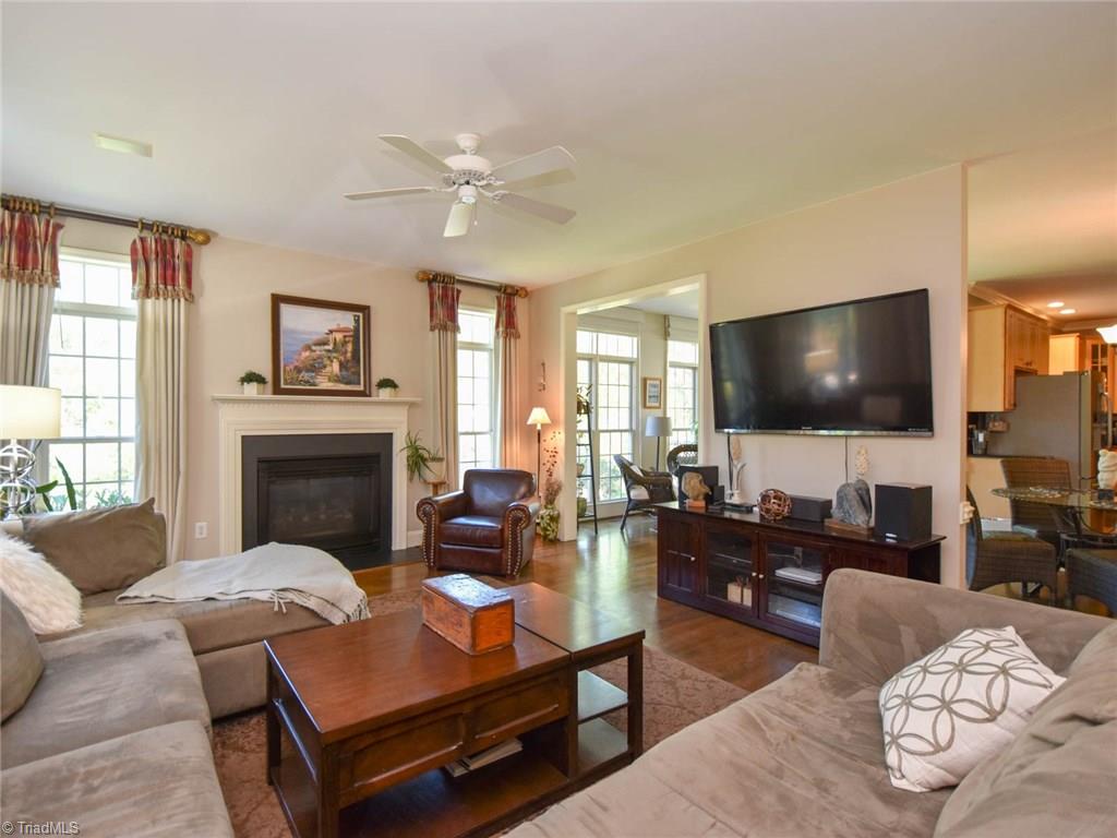 3817 Pinetop Road Greensboro, NC 27410 - Photo 10 of 29 Large den/family room opens to kitchen and has fireplace with gas logs.