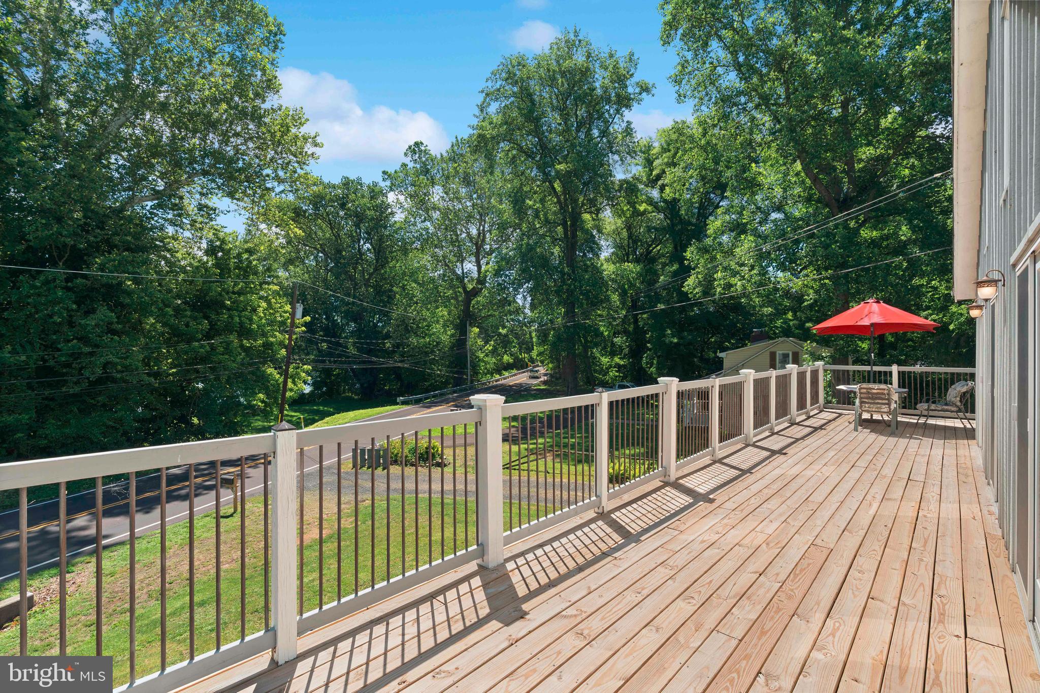 1473 North River Road Yardley, PA 19067 - Photo 9 of 42 a view of balcony with deck and wooden floor