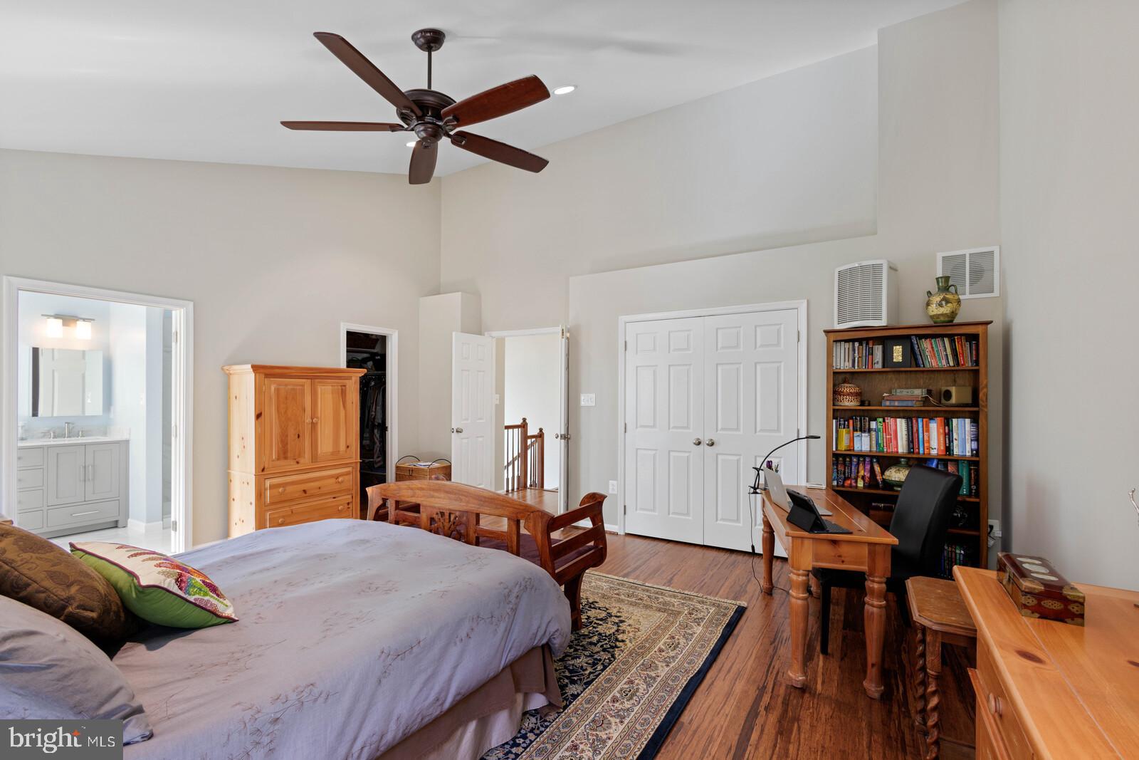 20713 Riptide Square Sterling, VA 20165 - Photo 13 of 65 a bedroom with a bed and wooden floor