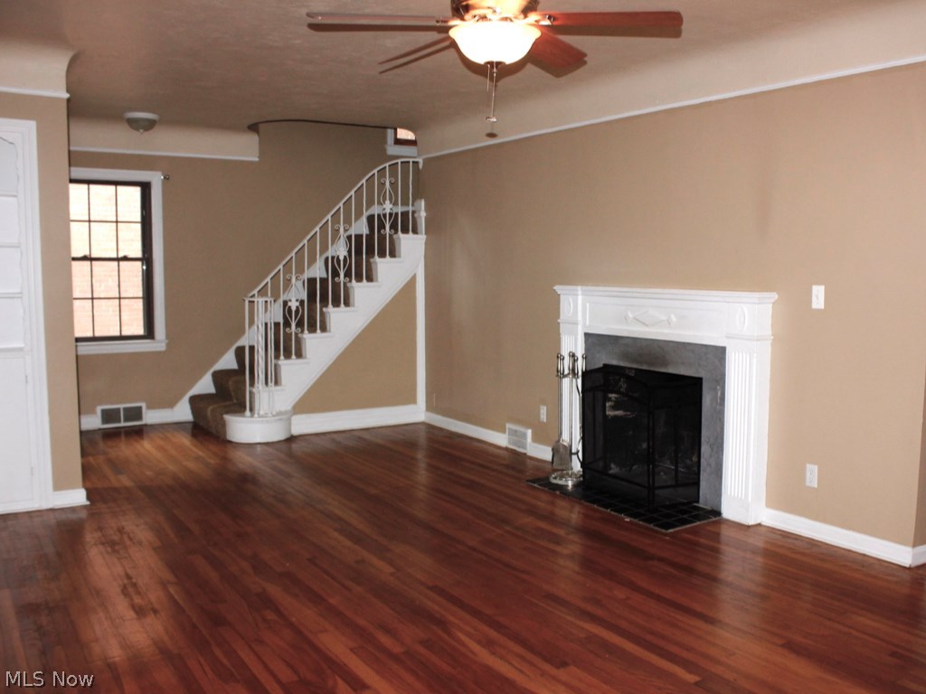 2187 Edgerton Road Cleveland, OH 44118 - Photo 3 of 14 LIVING ROOM SHOWING PRETTY FIREPLACE AND STAIRCASE TO SECOND FLOOR.
