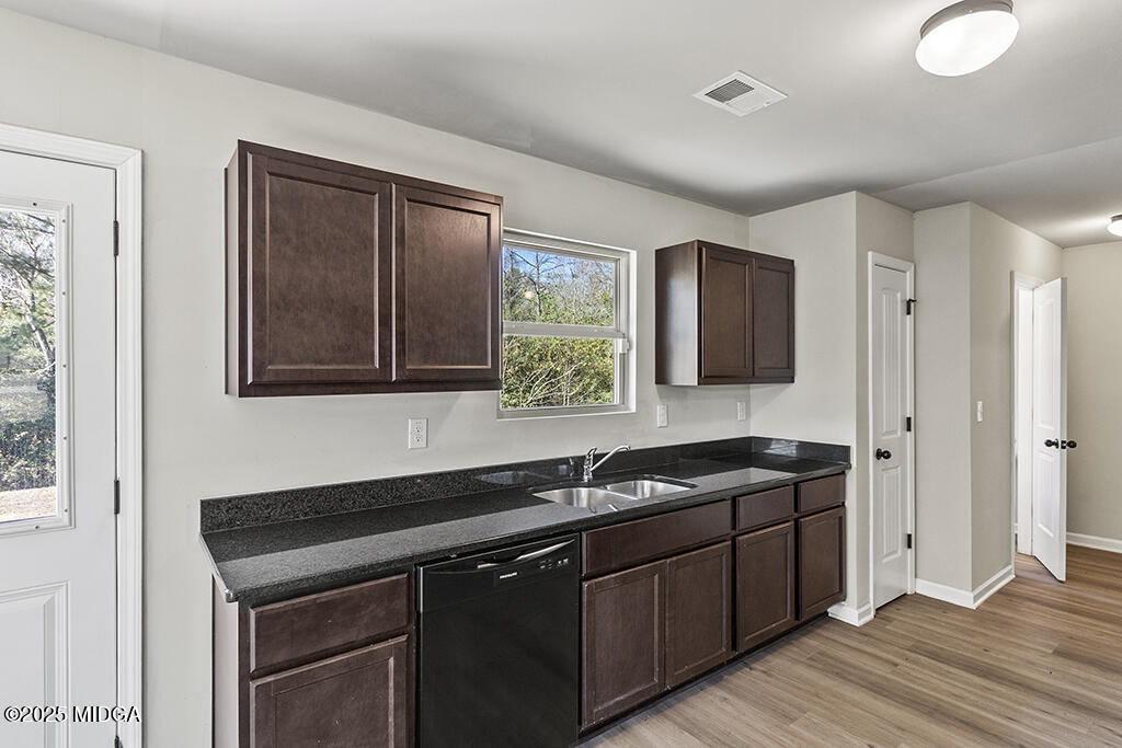 306 Mill Meadow Road Macon, GA 31216 - Photo 12 of 29 a kitchen with a sink and a window
