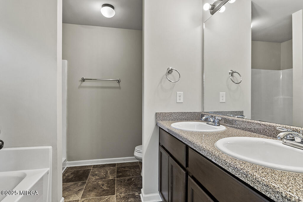 306 Mill Meadow Road Macon, GA 31216 - Photo 20 of 29 a bathroom with a sink and a mirror