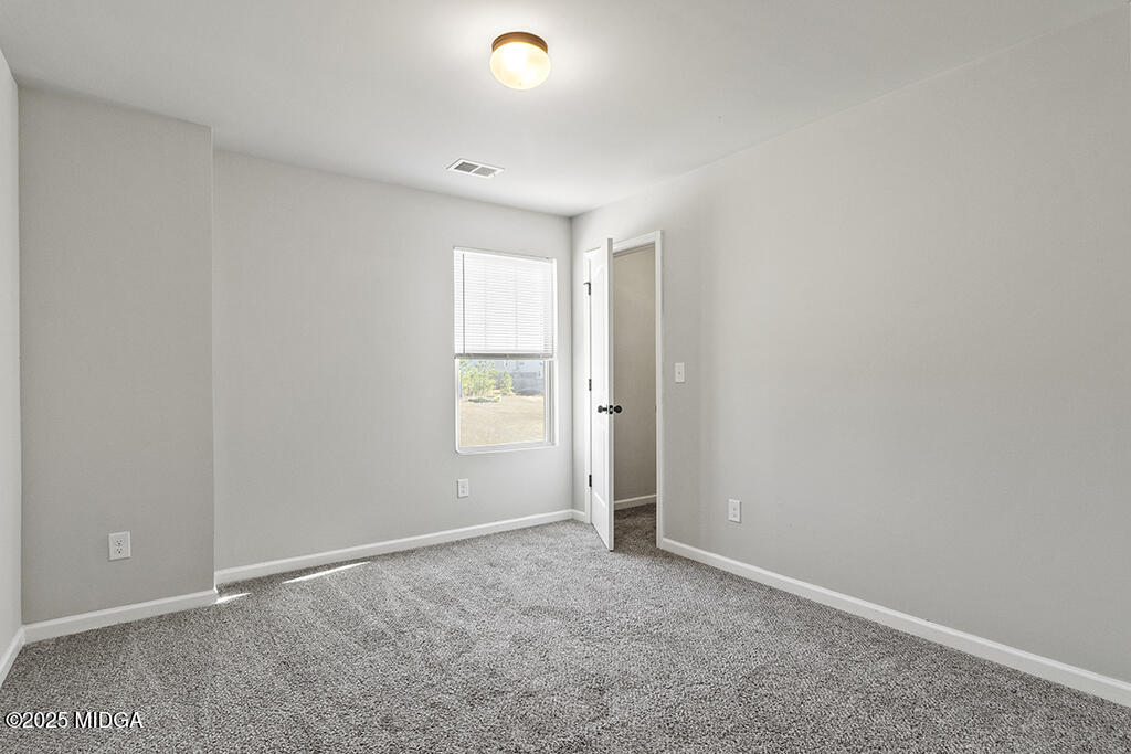 306 Mill Meadow Road Macon, GA 31216 - Photo 24 of 29 an empty room with windows and closet