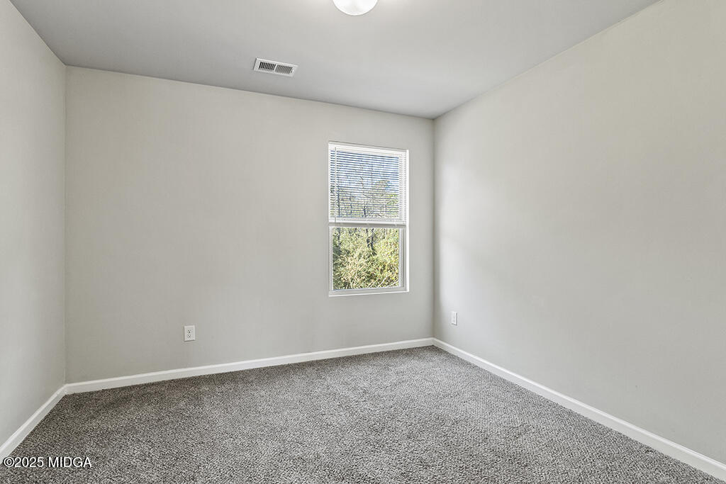306 Mill Meadow Road Macon, GA 31216 - Photo 26 of 29 an empty room with a window