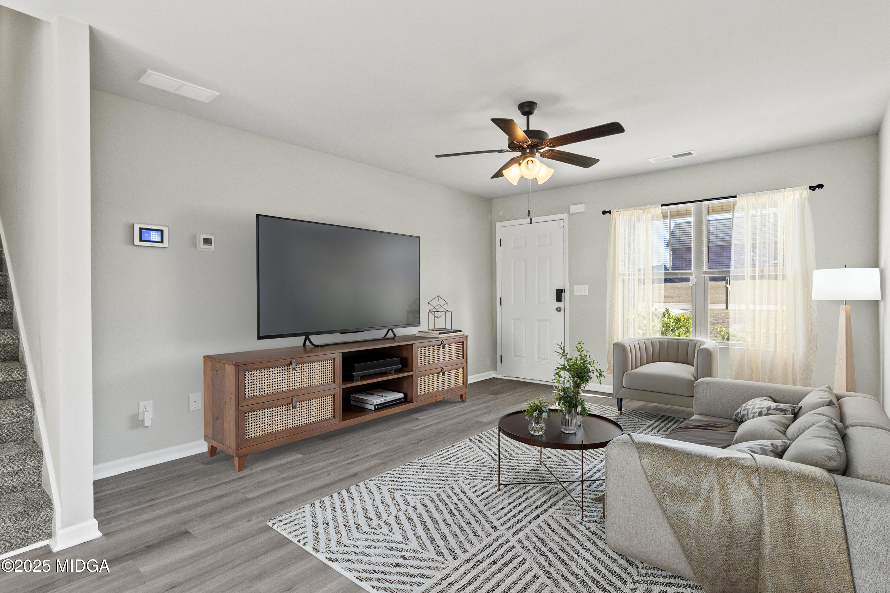 306 Mill Meadow Road Macon, GA 31216 - Photo 29 of 29 a living room with furniture and a flat screen tv
