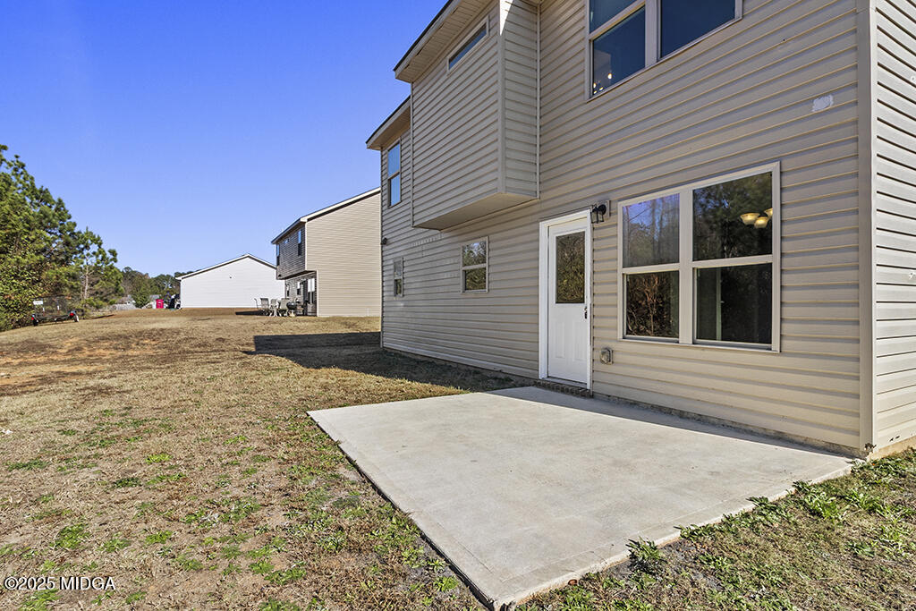 306 Mill Meadow Road Macon, GA 31216 - Photo 5 of 29 a view of a backyard of the house
