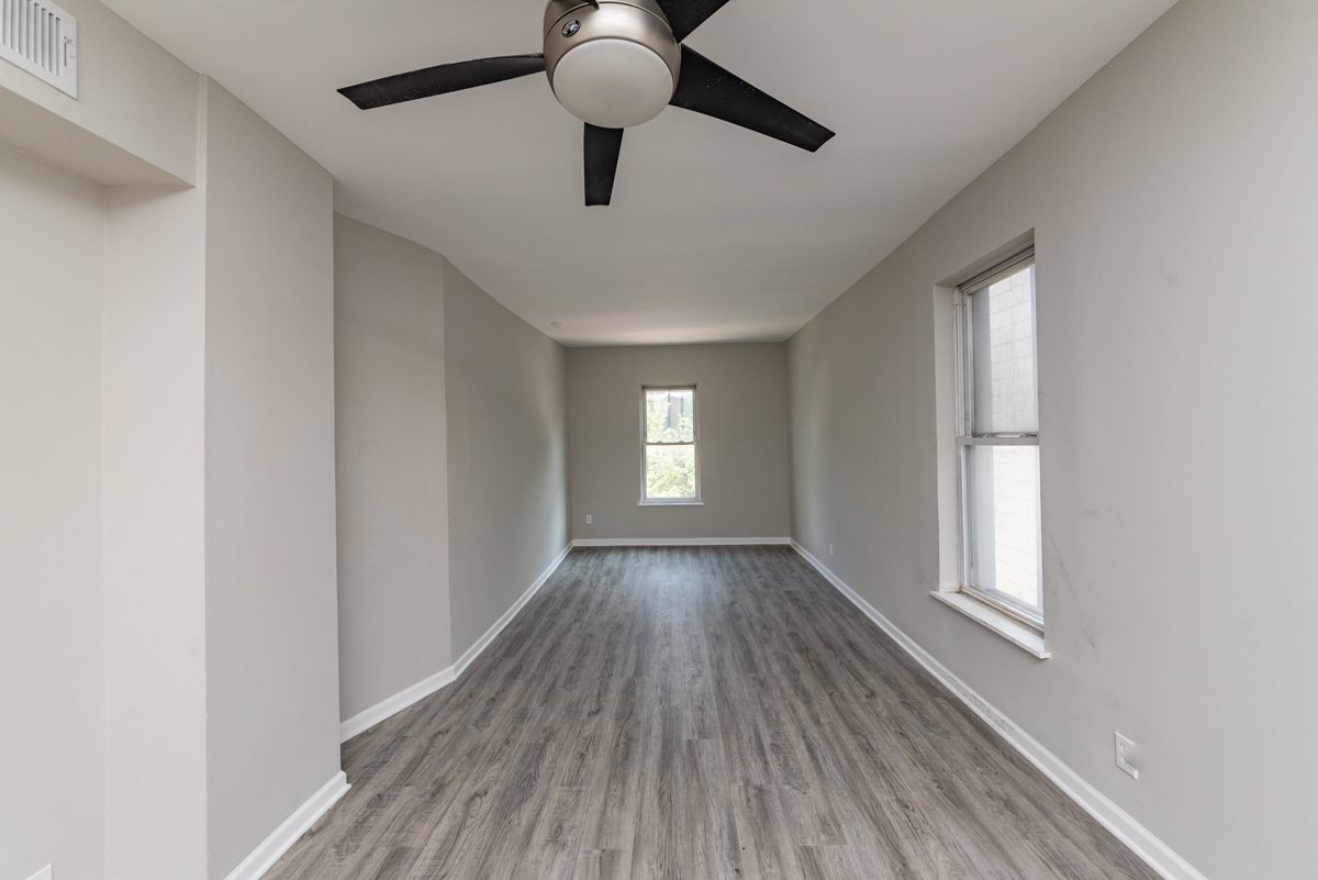 1022 West Fry Street, Unit 2F Chicago, IL 60642 - Photo 2 of 15 wooden floor in an empty room with a window