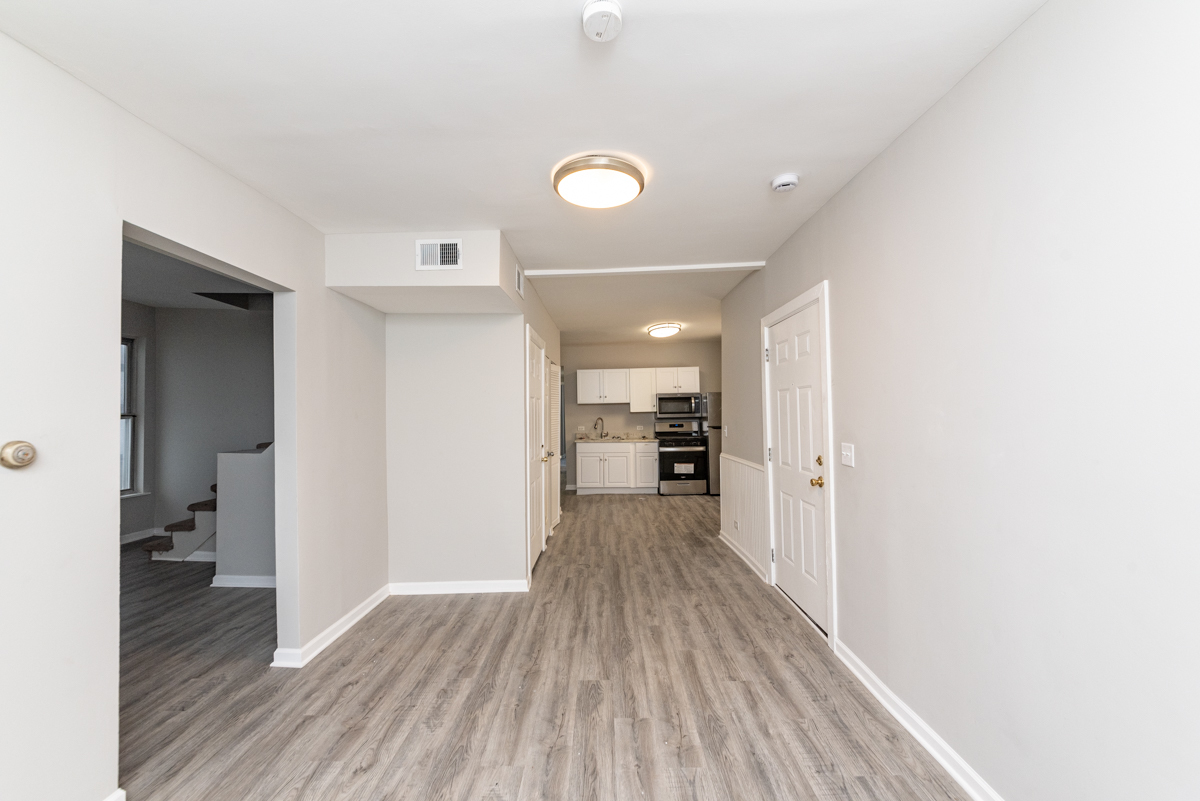 1022 West Fry Street, Unit 2F Chicago, IL 60642 - Photo 5 of 15 a view of a hallway with wooden floor