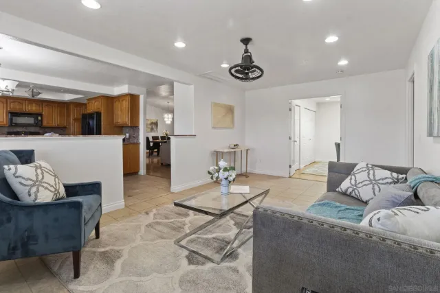 a view of an empty room and a ceiling fan