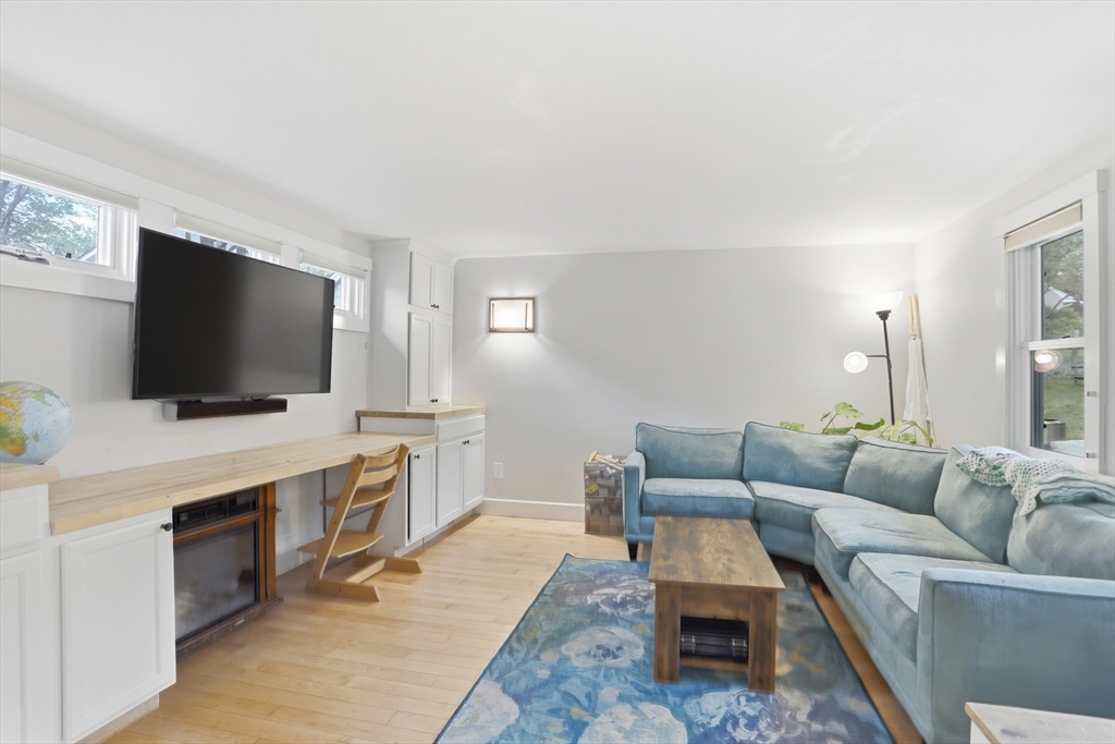80 Concord Street Maynard, MA 01754 - Photo 10 of 29 a living room with furniture and a flat screen tv