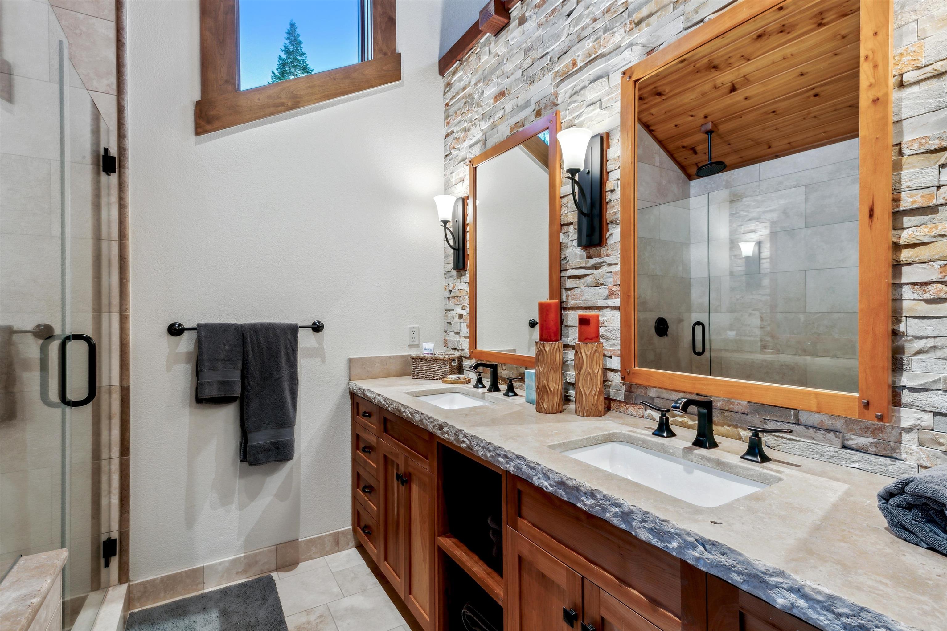 14204 Ski View Loop Truckee, CA 96161 - Photo 16 of 28 a bathroom with a granite countertop double vanity sink and mirror