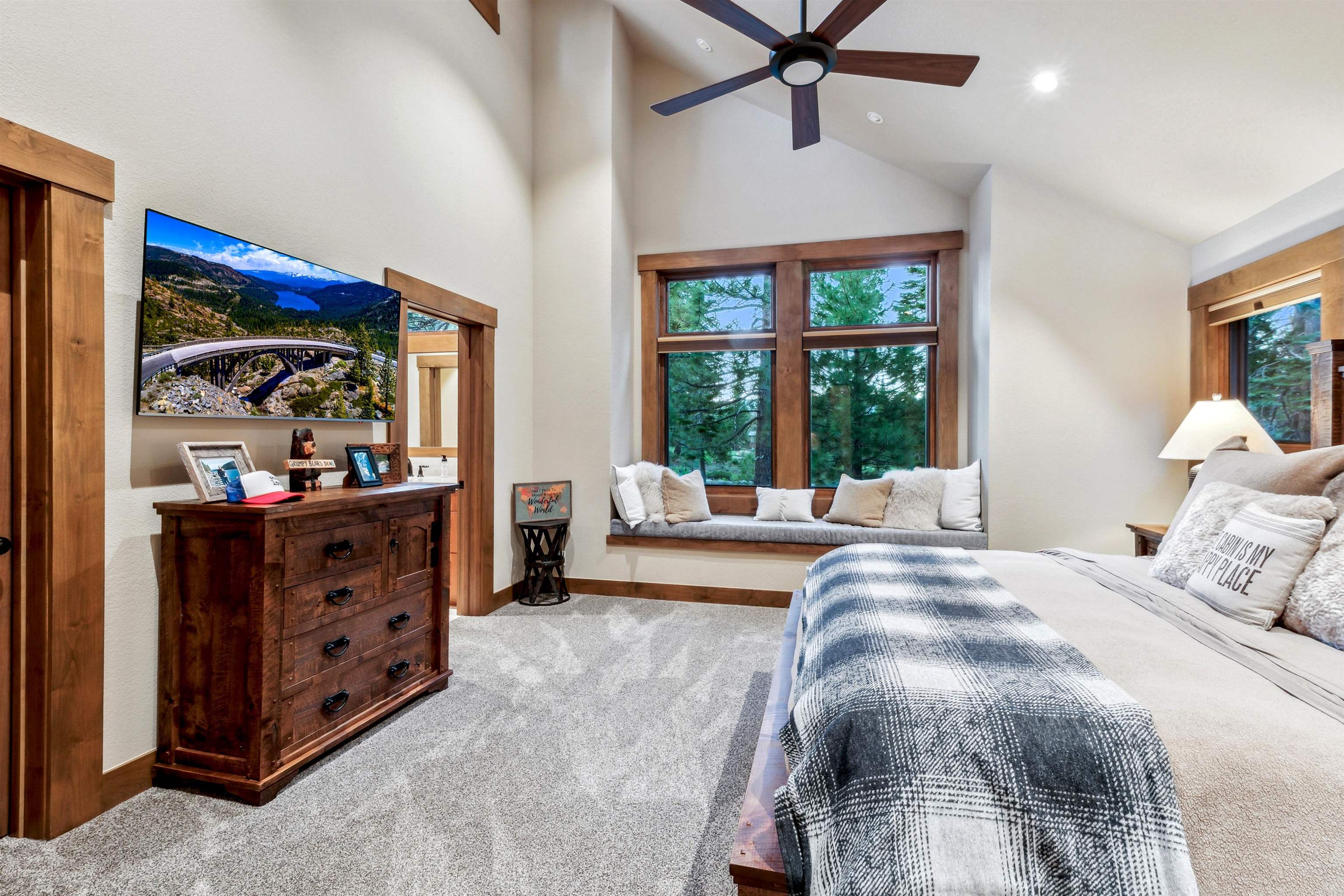 14204 Ski View Loop Truckee, CA 96161 - Photo 17 of 28 a bedroom with a bed and large windows