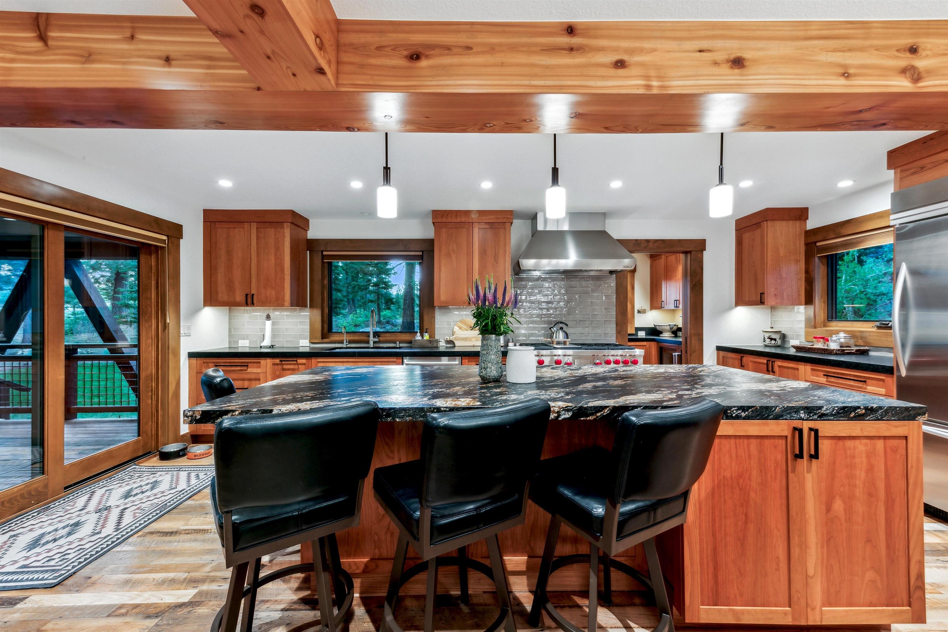 14204 Ski View Loop Truckee, CA 96161 - Photo 7 of 28 a kitchen with a sink and chairs