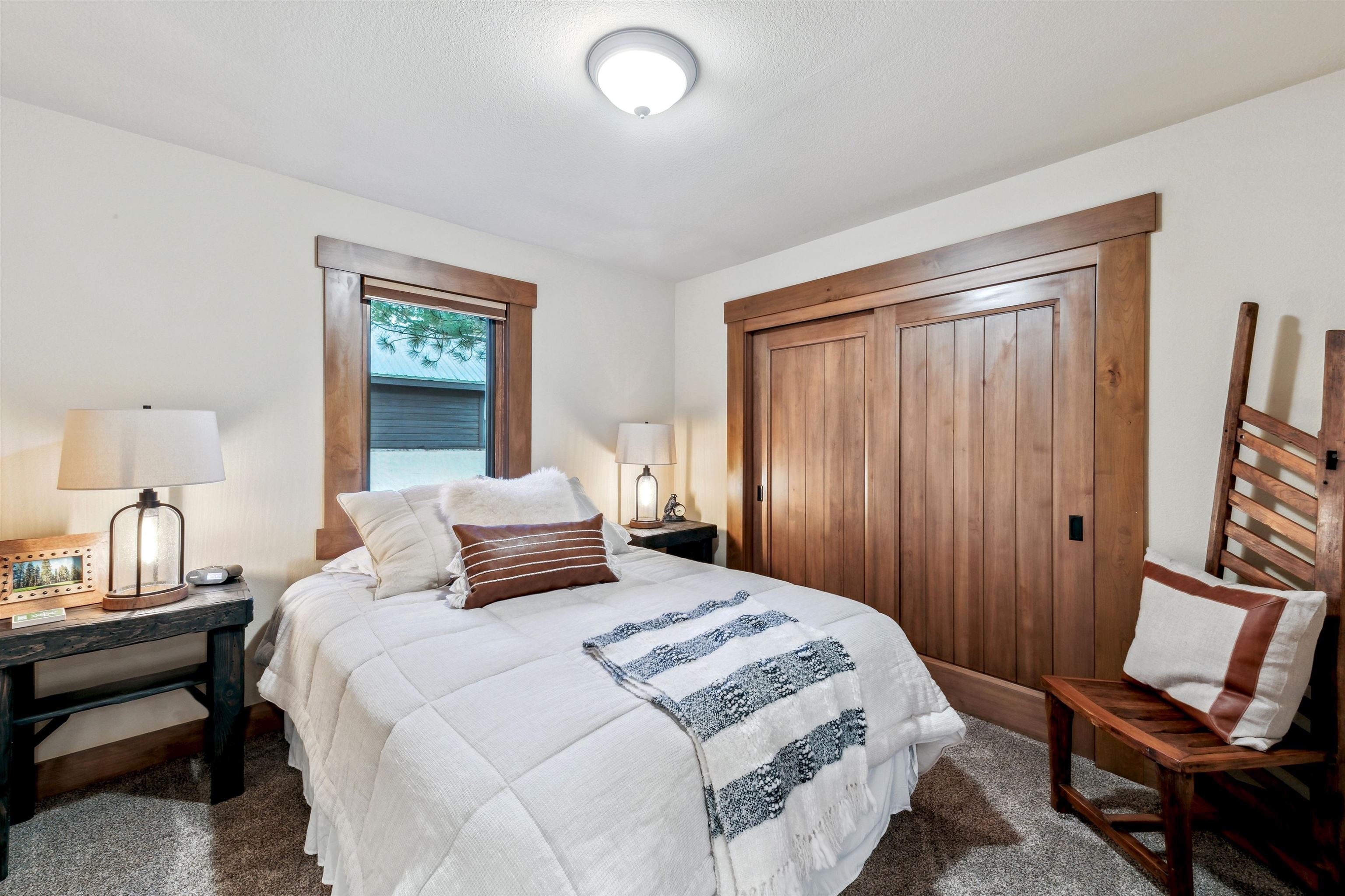 14204 Ski View Loop Truckee, CA 96161 - Photo 10 of 28 a bedroom with a bed and wooden floor